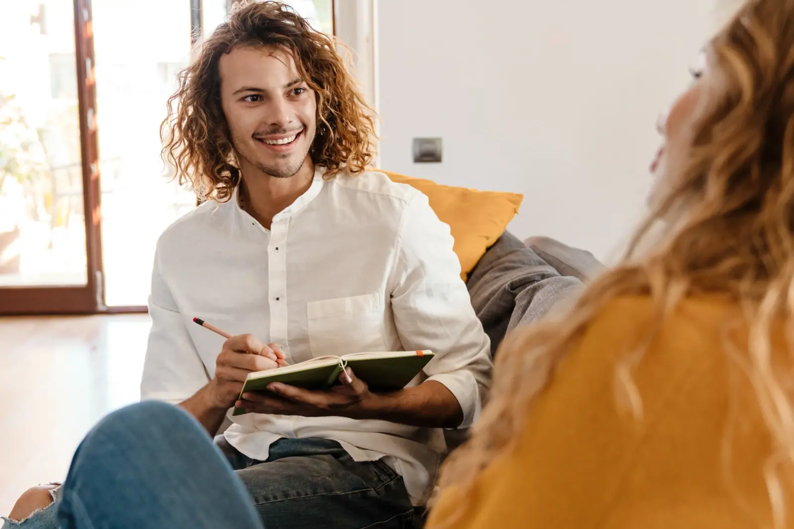 Man taking notes during a counseling session, illustrating private therapy at Bliss Recovery